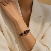 Pulsera de cordones de algodón lila con cristal facetado en forma elíptica de alta calidad.