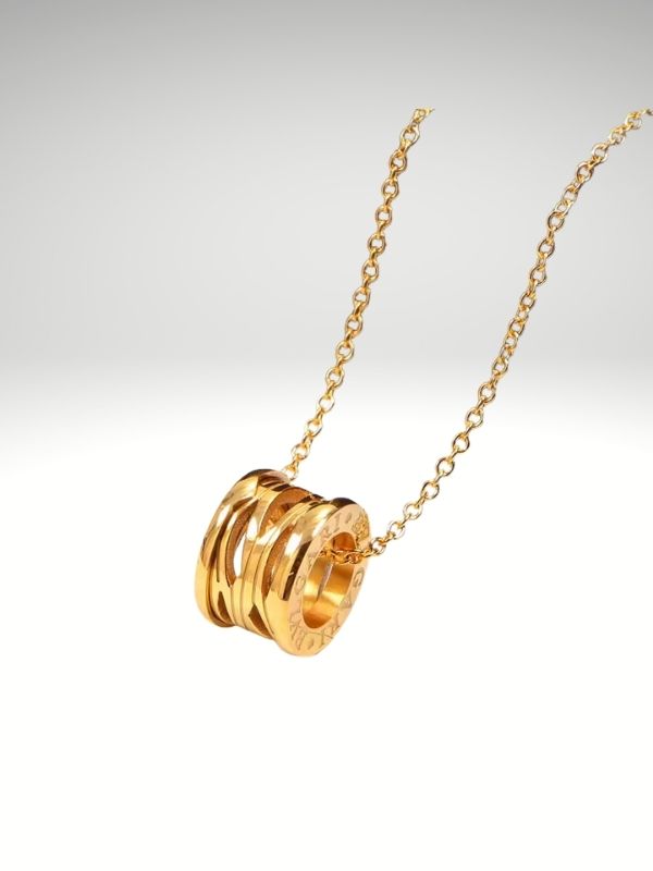 Colgante de acero 316L diseño italiano modelo cilíndrico Dorado.