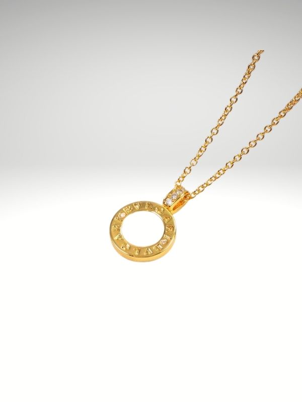 Colgante de acero 316L diseño italiano modelo medalla Piedra blanca Dorado.