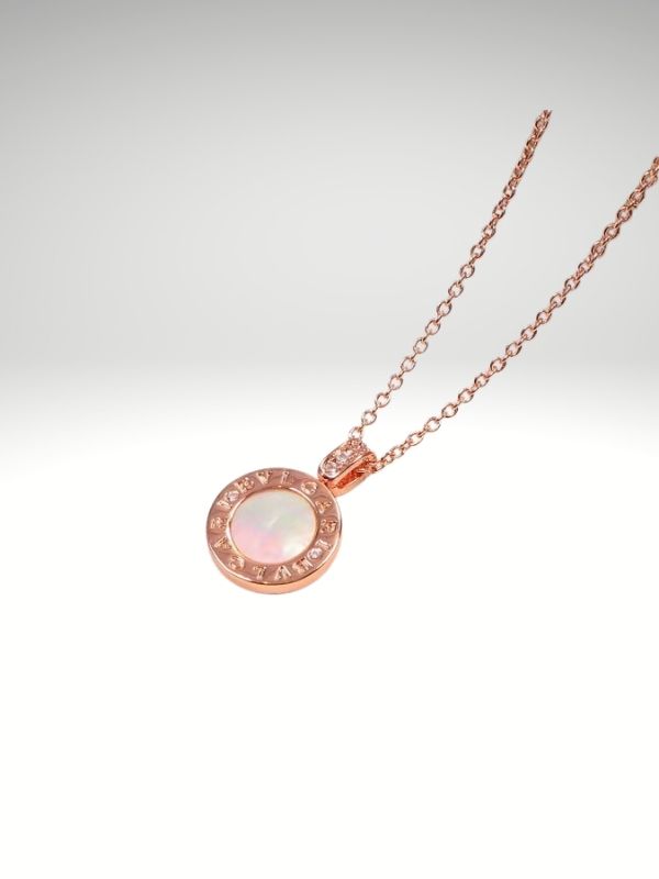 Colgante de acero 316L diseño italiano modelo medalla Piedra blanca Rosado.