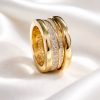 Anillo Acero dibujo circonitas dorado