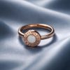 Anillo Acero rosado piedra blanca.