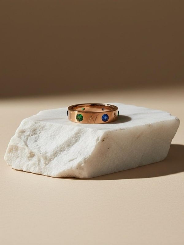 Anillo Acero rosado circonitas en verde y azul.