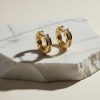 Pendientes Digno Acero 316L Aro Con Circonitas 4 Pendientes de aro abiertos de acero 316L color dorado con circonitas engastadas diseño italiano.